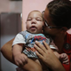 David Henrique Ferreira, 5 months, who was born with microcephaly, is kissed by his mother, Mylene Helena Ferreira, on Jan. 29, 2016, in Recife, Brazil. In the last four months, authorities have recorded around 4,000 cases in Brazil in which the mosquito-borne Zika virus may have led to microcephaly in infants.
Mario Tama/Getty Images